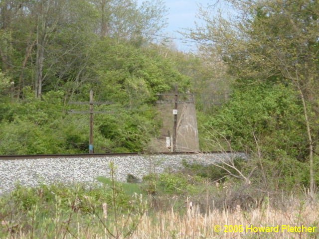 These abutments bridged the Wabash Railroad line east of Logansport and carried both the Union Traction line and the Ft. Wayne & Wabash Valley interurban lines.  The south abutment is hidden in the trees.  Howard Pletcher