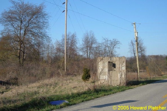 "This is the Stoner's Station on the Toledo and Chicago between Huntertown and Garrett. The ROW paralleled Shoaff Road behind me then curved off to the left where the tall pole is now and through the brush." © Howard Pletcher