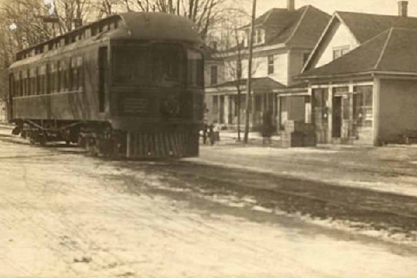 POSTCARD VIEW IN CUMBERLAND, INDIANA SHOWING TERRE HAUTE, INDIANAPOLIS & EASTERN STOREFRONT DEPOT THAT IS NOW BOB'S BARBER SHOP